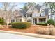Charming two-story traditional home with landscaped front yard, well-manicured hedges, and covered front porch at 426 Highcrest Dr, Acworth, GA 30101