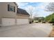 Beige two-car garage with an expansive concrete driveway and well-maintained landscaping at 426 Highcrest Dr, Acworth, GA 30101