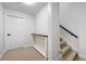Well-lit hallway with stairway, showing neutral decor and easy access to other areas at 426 Highcrest Dr, Acworth, GA 30101