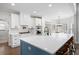 Well-equipped kitchen with an island featuring a white countertop and stylish brown seating at 426 Highcrest Dr, Acworth, GA 30101