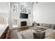Bright living room features a fireplace, hardwood floors, and large windows that provide ample natural light at 426 Highcrest Dr, Acworth, GA 30101