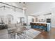 Spacious open-concept living room with high ceilings connects seamlessly to the modern kitchen and dining area at 426 Highcrest Dr, Acworth, GA 30101