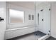 Sleek shower featuring white subway tile, a frosted window, a built-in bench, and glass enclosure at 426 Highcrest Dr, Acworth, GA 30101