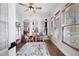 Bright sun room with windows, a ceiling fan and hardwood floors perfect for or relaxation at 426 Highcrest Dr, Acworth, GA 30101