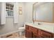 Bathroom with a sink, vanity, toilet and mirror at 582 Black Forest Run, Douglasville, GA 30134