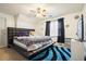 Bedroom featuring modern platform bed with a decorative rug and television at 582 Black Forest Run, Douglasville, GA 30134