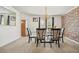 Traditional dining room with carpet, a stone accent wall, and a chandelier at 582 Black Forest Run, Douglasville, GA 30134