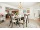 Elegant dining room with stylish furnishings and view of the open kitchen at 582 Black Forest Run, Douglasville, GA 30134