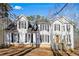 Inviting two-story home with white siding, black shutters, and a well-maintained lawn at 582 Black Forest Run, Douglasville, GA 30134