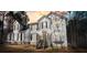Exterior daytime view of a two story home featuring multiple windows, dormers and a porch entry at 582 Black Forest Run, Douglasville, GA 30134