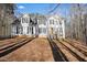 Charming two-story home featuring black shutters, a wood door, and a covered front porch with stairs at 582 Black Forest Run, Douglasville, GA 30134