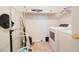 Bright laundry room features a washer, a dryer, and space for storage at 582 Black Forest Run, Douglasville, GA 30134
