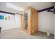 Basement sauna features a glass door in a room with carpeting and a drop ceiling at 582 Black Forest Run, Douglasville, GA 30134