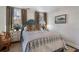 Bright bedroom featuring neutral walls, side tables and lamps, and two large windows at 586 Collier Rd, Atlanta, GA 30318