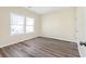 This vacant bedroom offers a neutral color scheme and two windows for ample natural light at 653 Armitage Way, Stockbridge, GA 30281