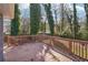 Spacious deck featuring a stained wood railing, and backyard views at 1694 Kenmore Sw St, Atlanta, GA 30311