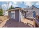 Charming backyard deck offering a perfect outdoor spot with stylish gray siding and trim at 1694 Kenmore Sw St, Atlanta, GA 30311