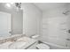 Bathroom with tub-shower combo, granite countertop, and neutral-colored walls at 1694 Kenmore Sw St, Atlanta, GA 30311