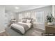 A staged bedroom featuring wood-look floors and lots of natural light at 1694 Kenmore Sw St, Atlanta, GA 30311