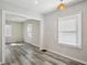 Well-lit dining area featuring new floors and contemporary light fixture at 1694 Kenmore Sw St, Atlanta, GA 30311