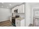 Modern kitchen featuring white cabinets, stainless steel appliances, and granite countertops at 1694 Kenmore Sw St, Atlanta, GA 30311