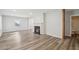 Bright living room featuring new floors, fireplace, and fresh white paint at 1694 Kenmore Sw St, Atlanta, GA 30311