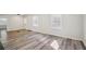 Spacious living room with lots of natural light highlighting the new floors at 1694 Kenmore Sw St, Atlanta, GA 30311