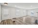 Bright living room with new floors, neutral paint, and a modern ceiling fan at 1694 Kenmore Sw St, Atlanta, GA 30311