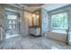 Spa-like bathroom featuring a walk-in shower, soaking tub, custom vanity, and elegant tile work at 3451 Paces Valley Nw Rd, Atlanta, GA 30327