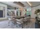 Bright, stylish dining room adjacent to a glass-walled staircase and large living space at 3451 Paces Valley Nw Rd, Atlanta, GA 30327