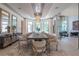 Elegant dining room with chandelier, large windows, sideboard and seating for twelve guests at 3451 Paces Valley Nw Rd, Atlanta, GA 30327