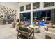 Expansive living room with a bar and large sliding doors opening to the pool and outdoor entertaining area at 3451 Paces Valley Nw Rd, Atlanta, GA 30327