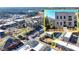 Aerial view of a three-story townhome highlighted as part of a community and park at 3601 Ridgeway Rd, Duluth, GA 30096