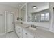 Bright bathroom featuring glass shower and a double vanity with two sinks at 3601 Ridgeway Rd, Duluth, GA 30096