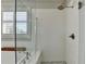 Bathroom with a clear glass enclosed shower with white subway tile and rainfall shower head at 3601 Ridgeway Rd, Duluth, GA 30096