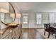 Open dining room featuring hardwood flooring, modern decor, and natural light through shuttered windows at 3601 Ridgeway Rd, Duluth, GA 30096