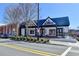 Charming exterior view of Lillie's restaurant featuring a blue roof, white paint, and well-manicured landscaping at 3601 Ridgeway Rd, Duluth, GA 30096