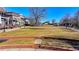 Open grassy area surrounded by brick walls and walking paths at 3601 Ridgeway Rd, Duluth, GA 30096