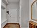 Hallway with built-in storage bench, hardwood floors, and white trim at 3601 Ridgeway Rd, Duluth, GA 30096