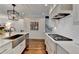 Open kitchen with stainless appliances, white cabinets and subway tile backsplash at 3601 Ridgeway Rd, Duluth, GA 30096