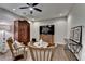 Well-lit living room with hardwood floors, ceiling fan, and comfortable seating around a center table at 3601 Ridgeway Rd, Duluth, GA 30096