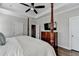 Bedroom featuring a four-poster bed, hardwood floors, and a tray ceiling at 3601 Ridgeway Rd, Duluth, GA 30096