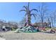 Playground featuring a colorful, artistic climbing structure and adjacent seating areas at 3601 Ridgeway Rd, Duluth, GA 30096