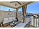 Inviting covered porch featuring neutral furniture, privacy curtains, and view of community at 3601 Ridgeway Rd, Duluth, GA 30096