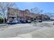 Street view of commercial buildings with parking and diverse storefronts under a clear sky at 3601 Ridgeway Rd, Duluth, GA 30096