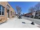 Inviting storefronts line a well-maintained sidewalk with benches, creating a pleasant and walkable streetscape at 3601 Ridgeway Rd, Duluth, GA 30096