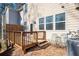 Back of home with deck and patio area featuring chairs for outdoor relaxing at 813 Whittington Sw Pkwy, Marietta, GA 30060