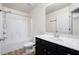 Well-lit bathroom with modern vanity and shower-tub combo at 813 Whittington Sw Pkwy, Marietta, GA 30060