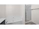 Bright bathroom features a soaking tub and glass shower at 813 Whittington Sw Pkwy, Marietta, GA 30060