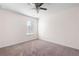 This bedroom features carpeted floors, ceiling fan, and lots of sunlight at 813 Whittington Sw Pkwy, Marietta, GA 30060